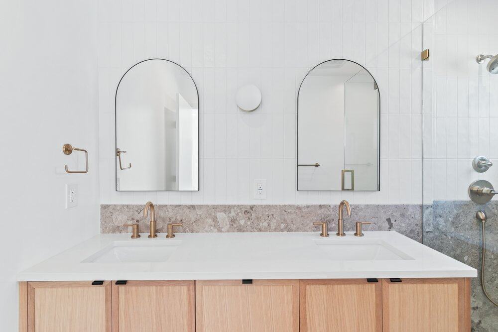 Arched Mirrors, double vanity bathroom remodel in Orange County by OC Builders Group